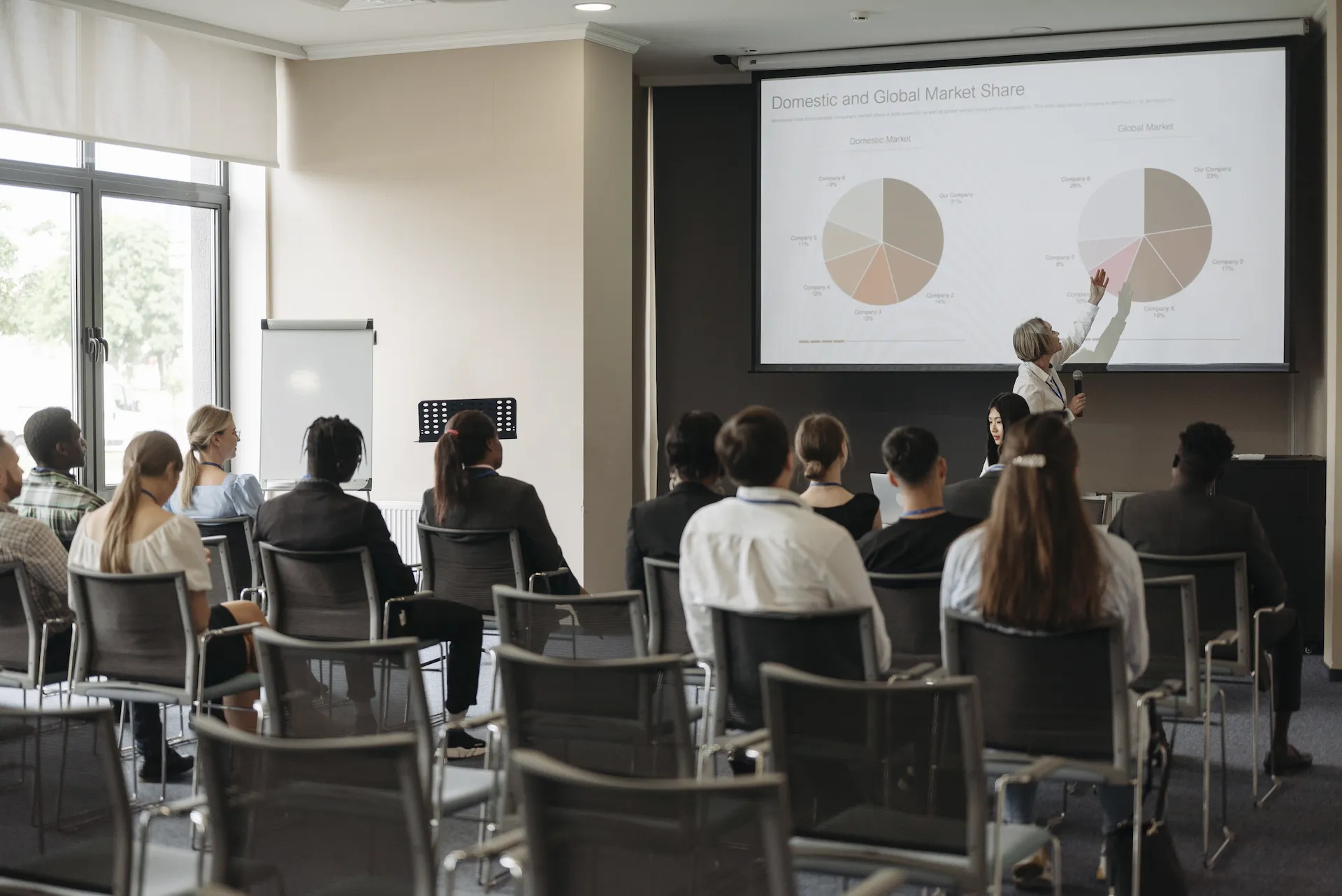 A picture with people looking at global market analytics